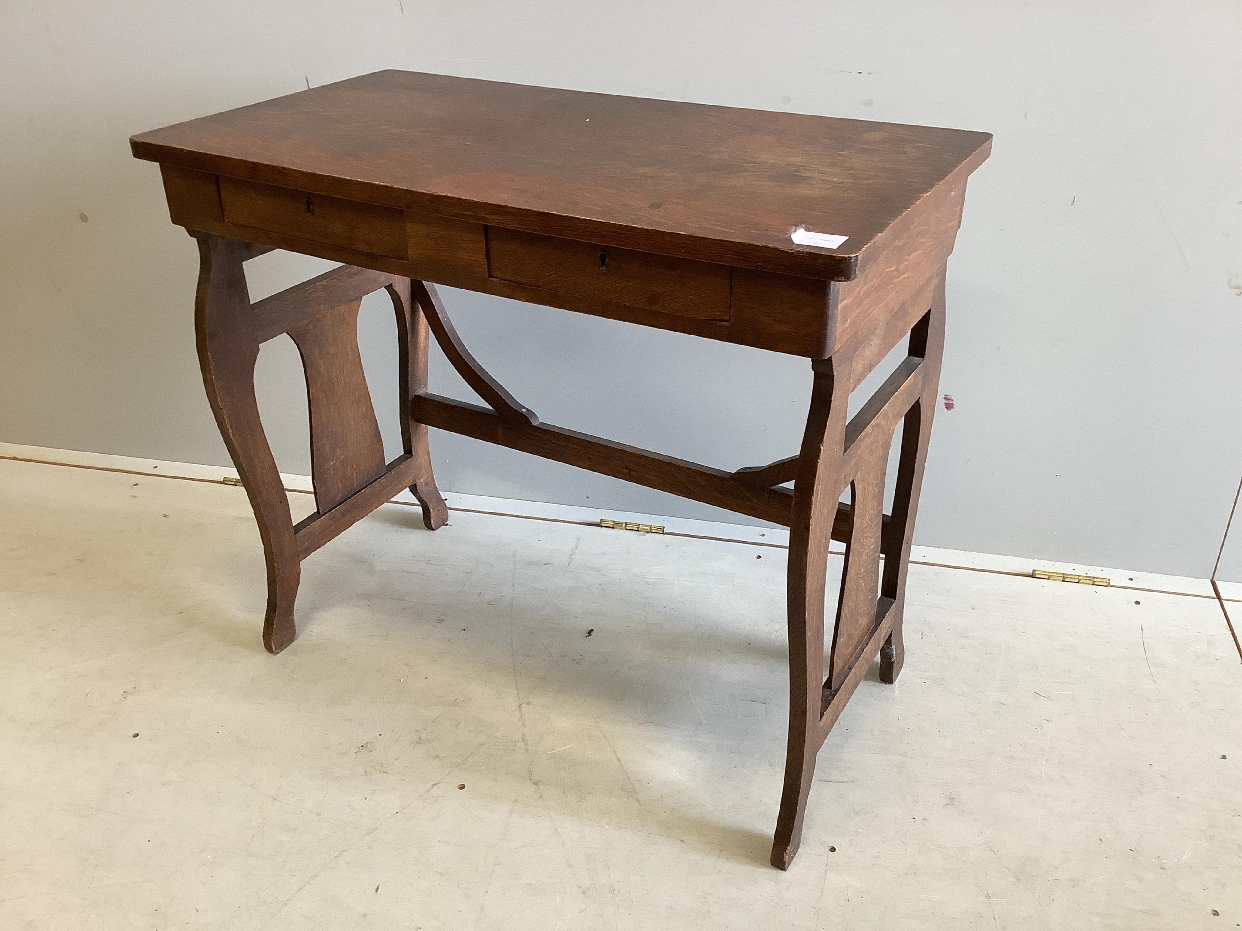 An early 20th century Continental oak two drawer side table, width 82cm, depth 44cm, height 72cm. Condition - fair